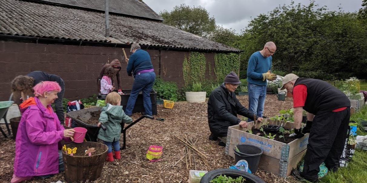 5 Hard at work PLANTING UP our permaculture community garden in MK