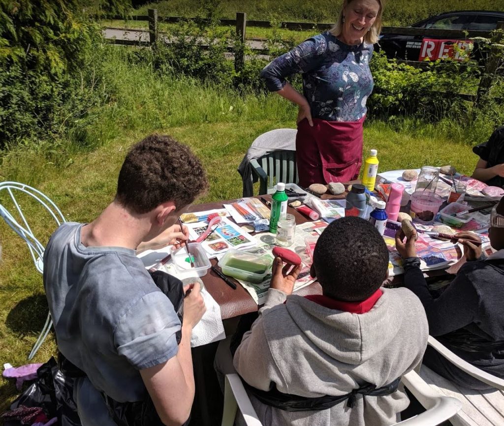 GIV MK volunteers creating pebble signs