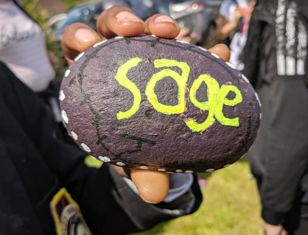A sage pebble sign