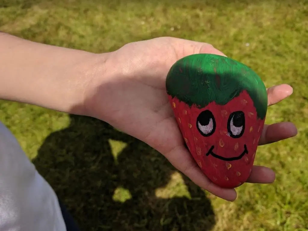 A strawberry pebble sign