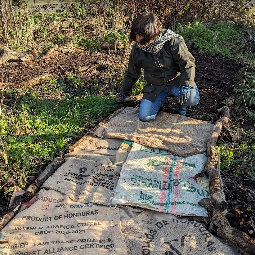 Pat fixing the sacks along the edging